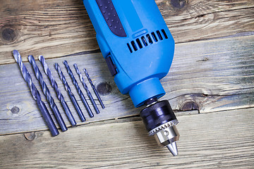 Image showing electric drill with a set of drill bits