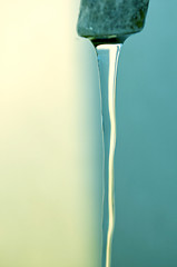 Image showing Tap of running water isolated on grey background