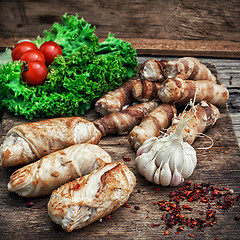 Image showing set fried meat sausages on wooden background