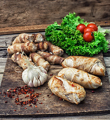 Image showing set fried meat sausages on wooden background