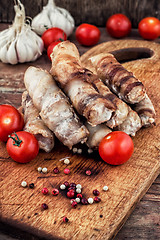 Image showing set fried meat sausages on wooden background