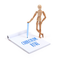 Image showing Wooden mannequin writing in scrapbook - Curriculum vitae