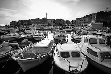 Image showing Boats in marina of Rovinj at sunset bw