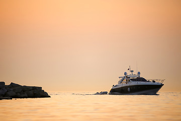 Image showing Boat with dinghy in sea