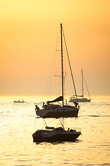 Image showing Boats sailing at sunset