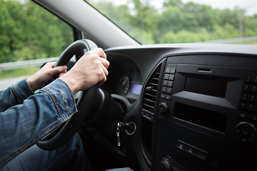 Image showing hand of man driving a car