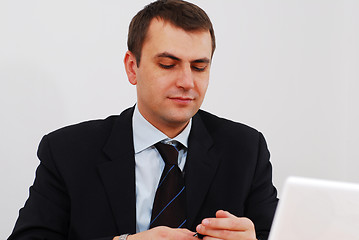 Image showing Successful businessman answering the phone