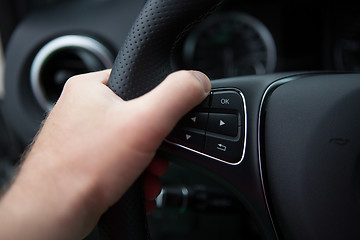 Image showing hand of man driving a car