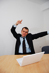 Image showing Successful businessman cheering