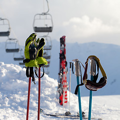 Image showing Protective sports equipments on ski poles at ski resort