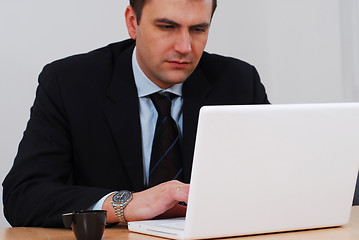 Image showing Businessman working on white computer