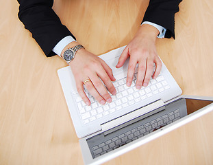 Image showing Hands on white laptop