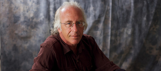 Image showing blue eyed man with glasses and grey hair