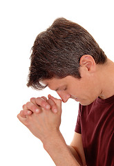 Image showing Praying young man in profile.