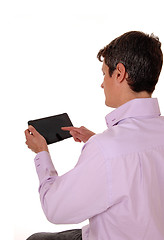 Image showing Man with tablet from back.