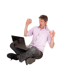 Image showing Scared man from his laptop.