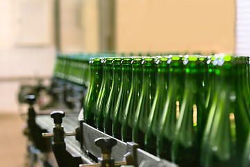 Image showing Many bottles on conveyor belt