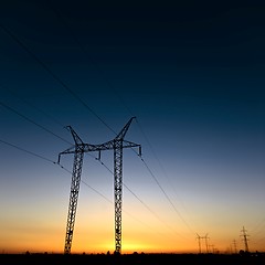 Image showing Large transmission towers at blue hour 