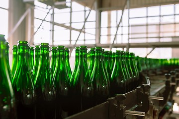 Image showing Many bottles on conveyor belt