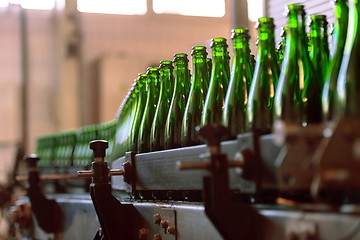 Image showing Many bottles on conveyor belt