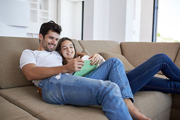 Image showing couple at modern home using tablet computer