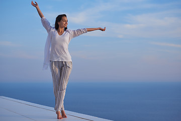 Image showing young woman enjoy sunset