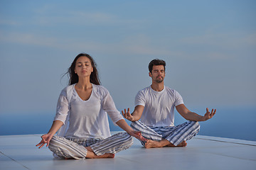 Image showing young couple practicing yoga