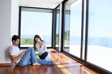 Image showing relaxed young couple at home staircase