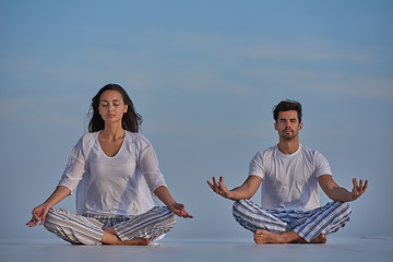 Image showing young couple practicing yoga