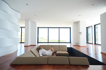 Image showing Portrait of senior man relaxing in sofa