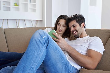 Image showing couple at modern home using tablet computer