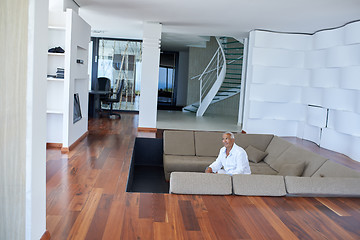 Image showing Portrait of senior man relaxing in sofa