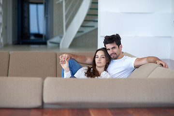 Image showing relaxed young couple at home staircase