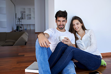 Image showing relaxed young couple at home staircase