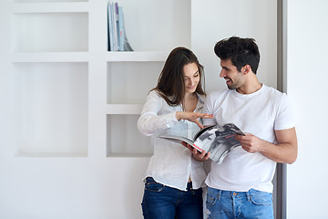 Image showing relaxed young couple at home staircase