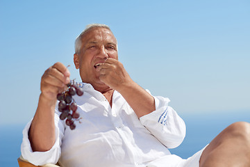 Image showing senior man sitting outside