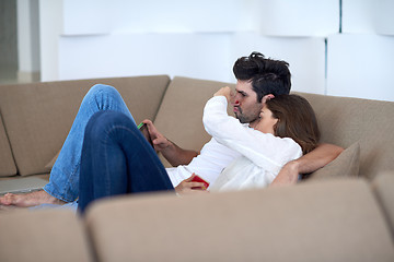 Image showing couple at modern home using tablet computer