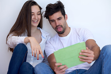 Image showing couple at modern home using tablet computer