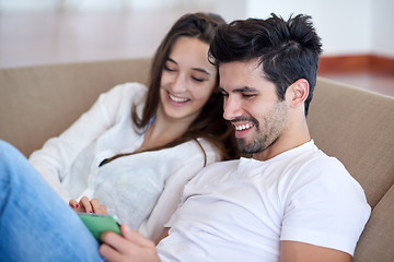 Image showing couple at modern home using tablet computer