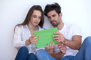 Image showing couple at modern home using tablet computer