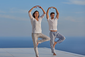 Image showing young couple practicing yoga