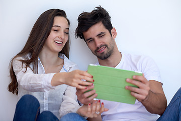 Image showing couple at modern home using tablet computer