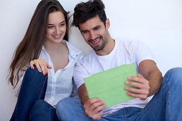 Image showing couple at modern home using tablet computer