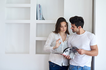 Image showing relaxed young couple at home staircase