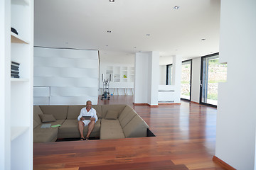 Image showing Portrait of senior man relaxing in sofa