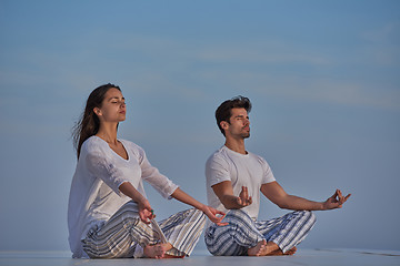 Image showing young couple practicing yoga