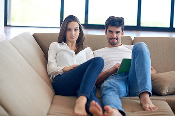 Image showing couple at modern home using tablet computer