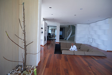 Image showing Portrait of senior man relaxing in sofa