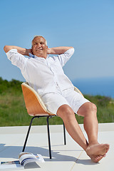 Image showing senior man sitting outside