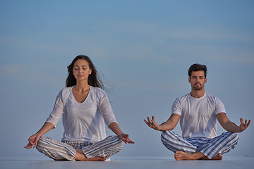 Image showing young couple practicing yoga